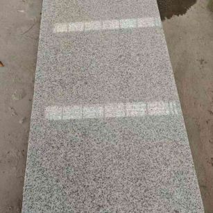 拉萨芝麻白光面毛板