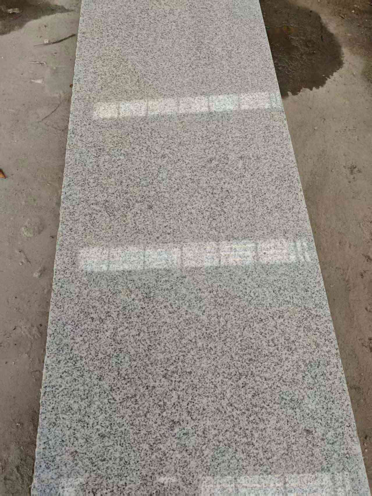 拉萨芝麻白光面毛板